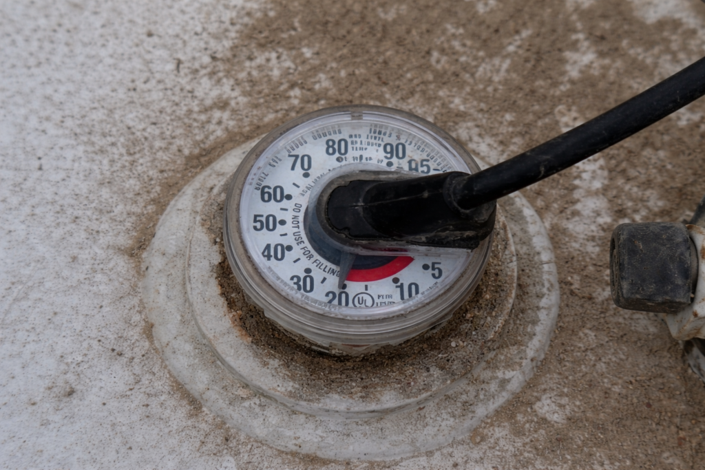 propane tank regulator and valve connection on residential propane tank