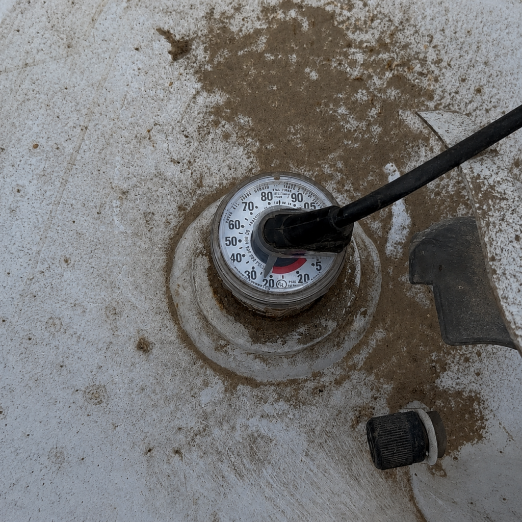 Residential propane tank gauge showing the percentage of propane remaining